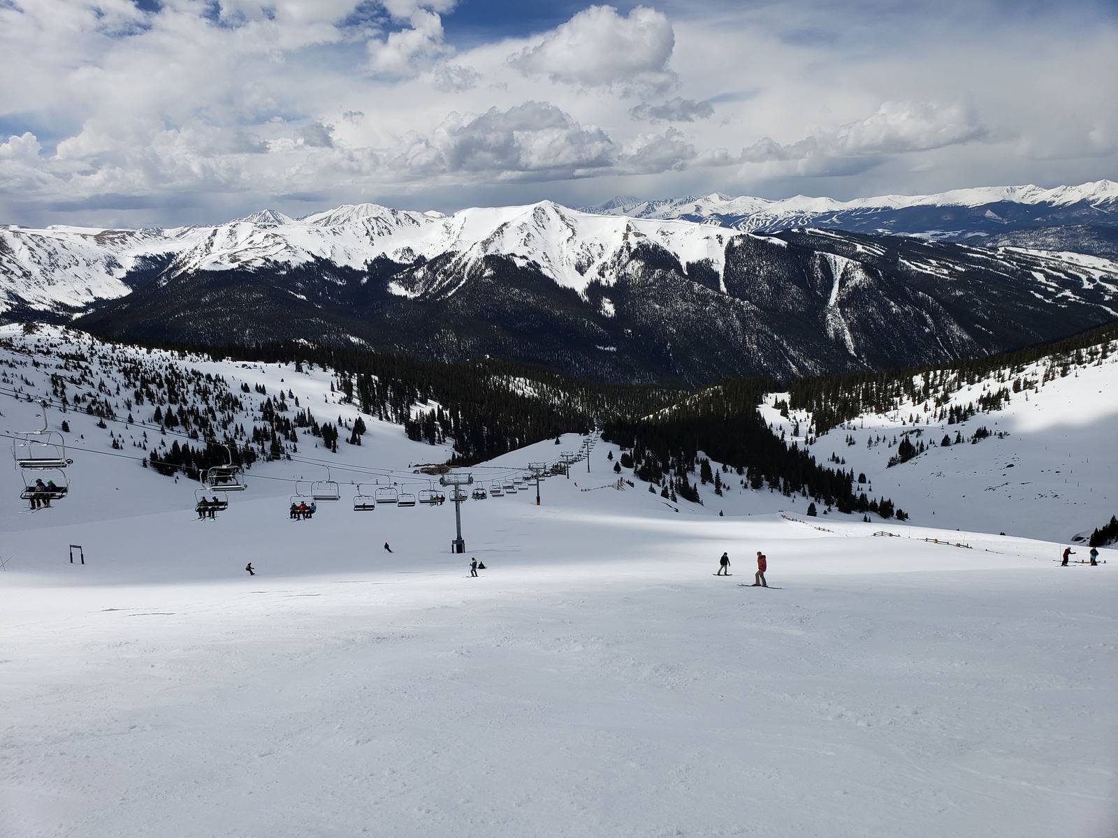 Skiers ride the Zuma lift in the Montezuma Bowl at Arapahoe Basin, one of three Alterra resorts in Colorado.