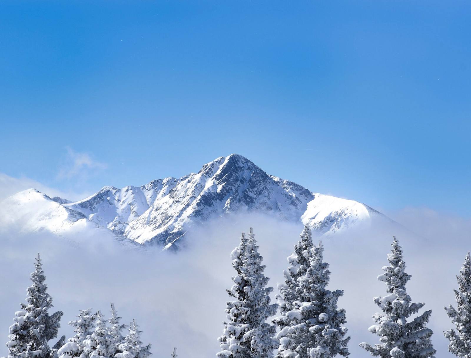 The mountains above Vail in winter, in a file photograph. Vail Mountain is scheduled to open Nov. 13, a date the company says remains subject to weather and conditions.