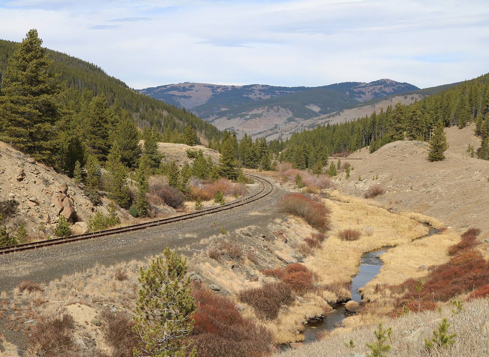 The South Fork of the Eagle River threads a high valley between Tennessee Pass and Camp Hale, beside the railroad grade. Headwaters streams like this one are the first to show an early, low runoff year of the kind the report documents.