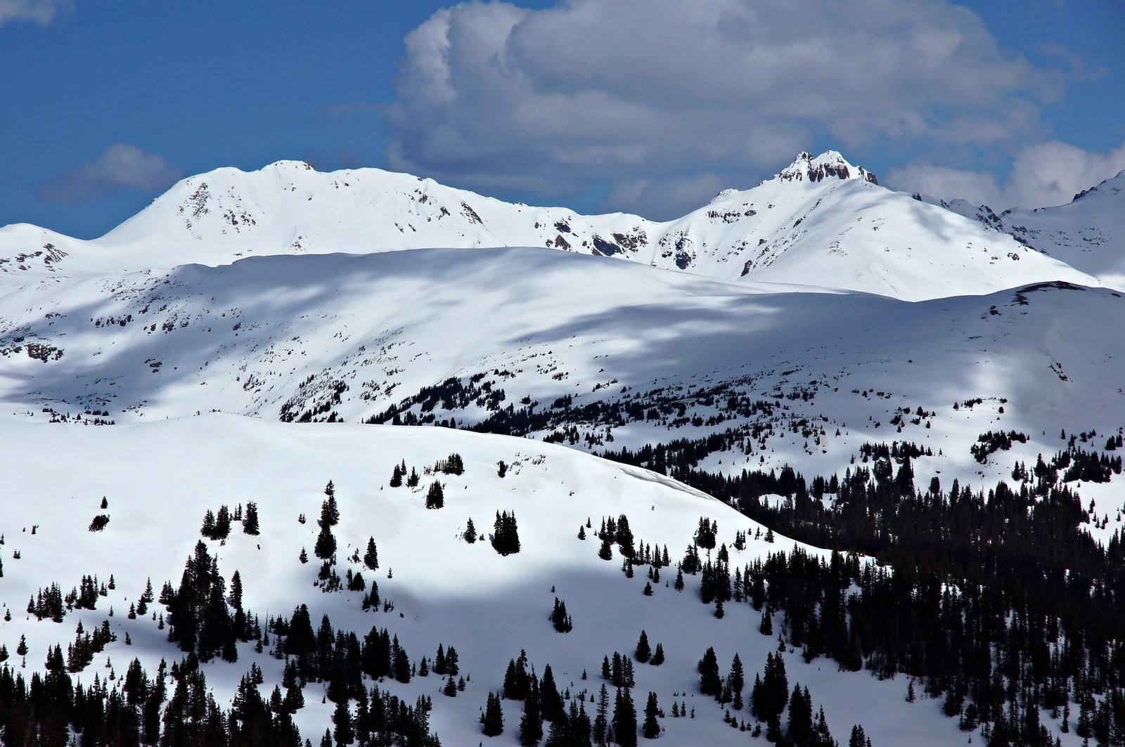 Clouds move over snow-covered peaks at Loveland Pass. Illustrative photo.
