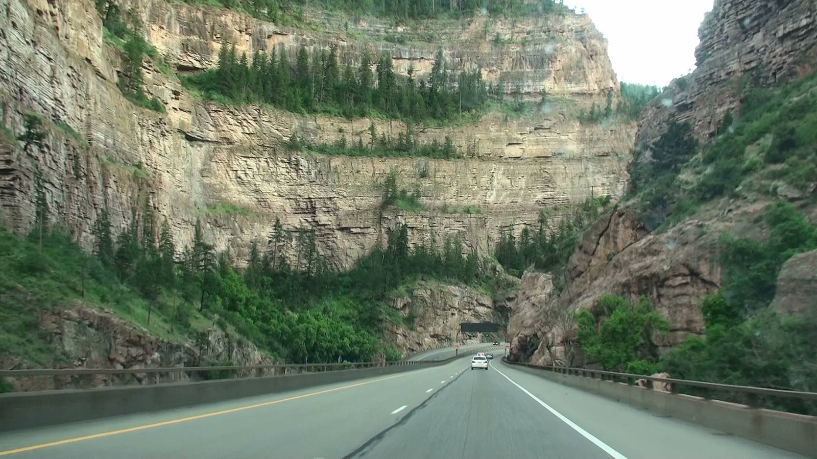 Interstate 70 threading through Glenwood Canyon above the Colorado River corridor. The canyon is the only interstate route west from Eagle County toward Glenwood Springs and Grand Junction.