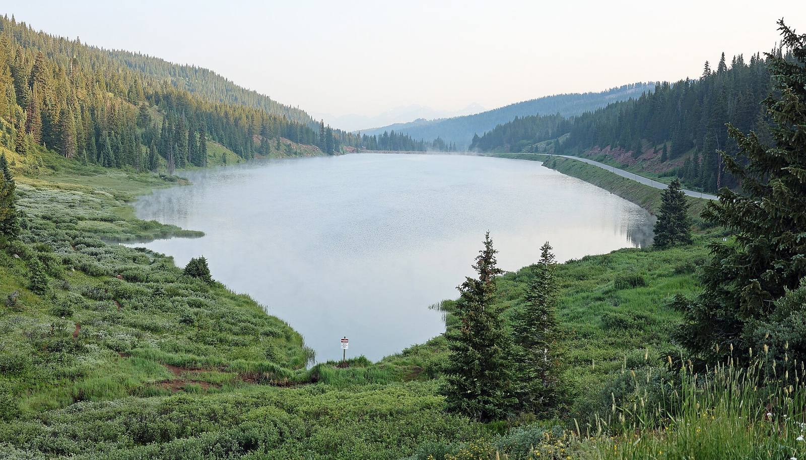 Black Lake, at the top of Vail Pass beside Interstate 70, in a file photograph from a summer morning. Terrain at the pass was inside the advisory area this week; the photograph shows the place, not this week's conditions.