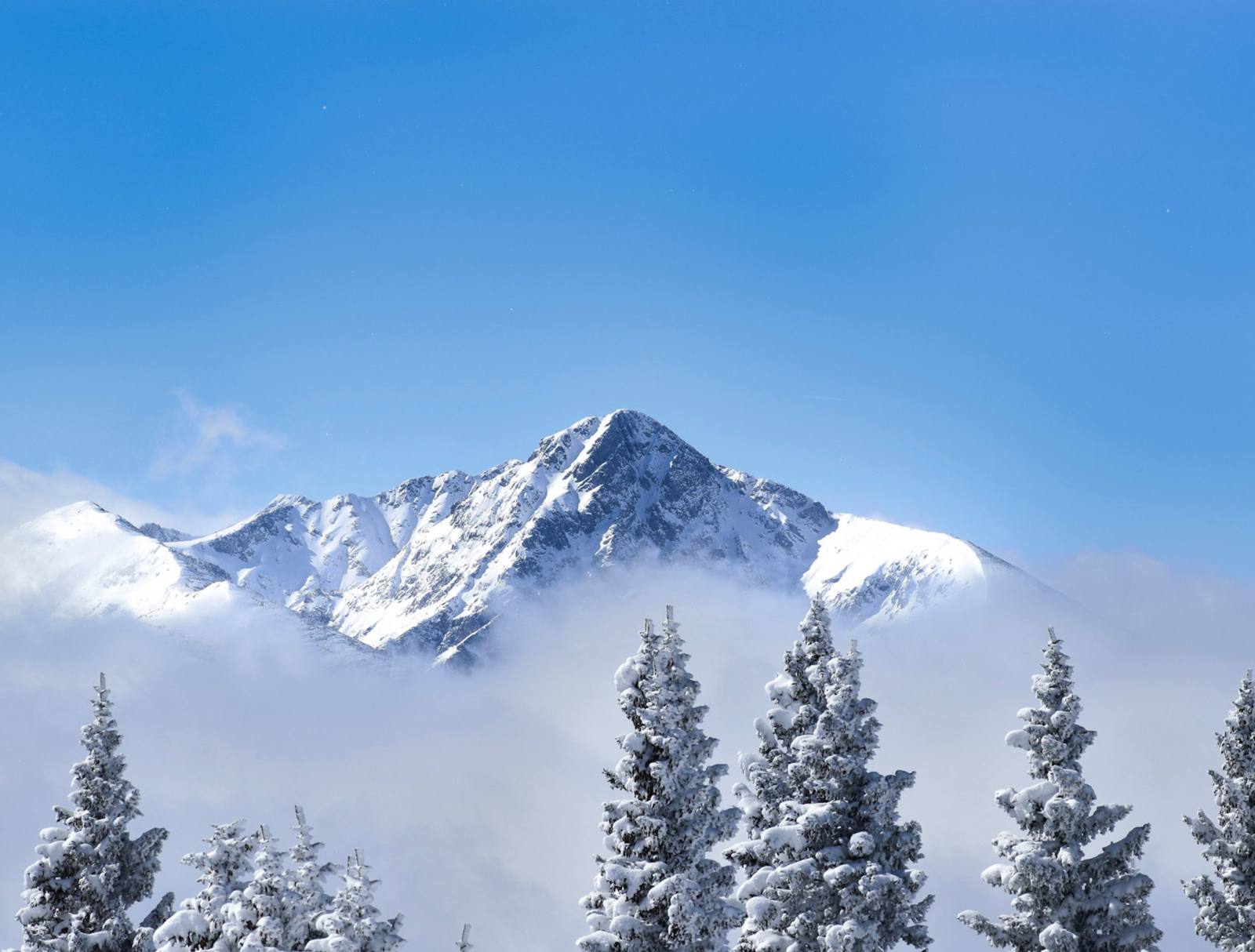 Snow covered peaks above Vail, Colorado, in a file photograph. The company's Oct. 19 filing argues its board and strategy are already delivering, pointing to record guest satisfaction scores in fiscal 2026 despite a weak snow year in the Rockies.
